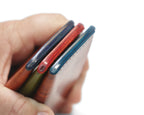Shared bottom-edge detail of three Scout color combinations