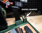 Close-up of the green tactical EDC tray, with a “BARREL BUMPER” arrow pointing to the tan pad around the pistol stand post.
