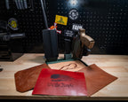 Green tactical EDC tray with a tan Bigfoot Forge Co. logo liner beside brown, textured brown and red “We the People” liner samples.