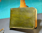 Angled view of an Army Green Topo leather bifold wallet