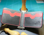 Open Black Forgehand bifold showing four card slots and red stitching