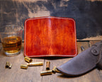 Bourbon wallet opened flat to show the hand-dyed topographic leather exterior and contrast stitching.