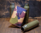 Angled view of the Woodland Camo vertical wallet showing the camouflage leather pattern and stitched perimeter.