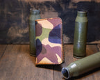 Forgehand Field Woodland Camo vertical leather wallet with a camouflage exterior and orange contrast stitching.